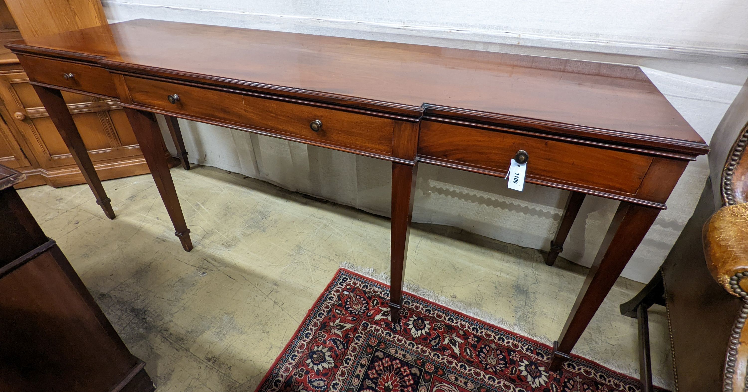 An Edwardian mahogany break front serving table by Howard & Son, London, width 214cm, depth 60cm, height 85cm